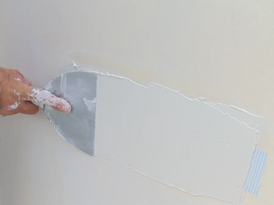 Close detail of sheetrock finishing and seam repair work