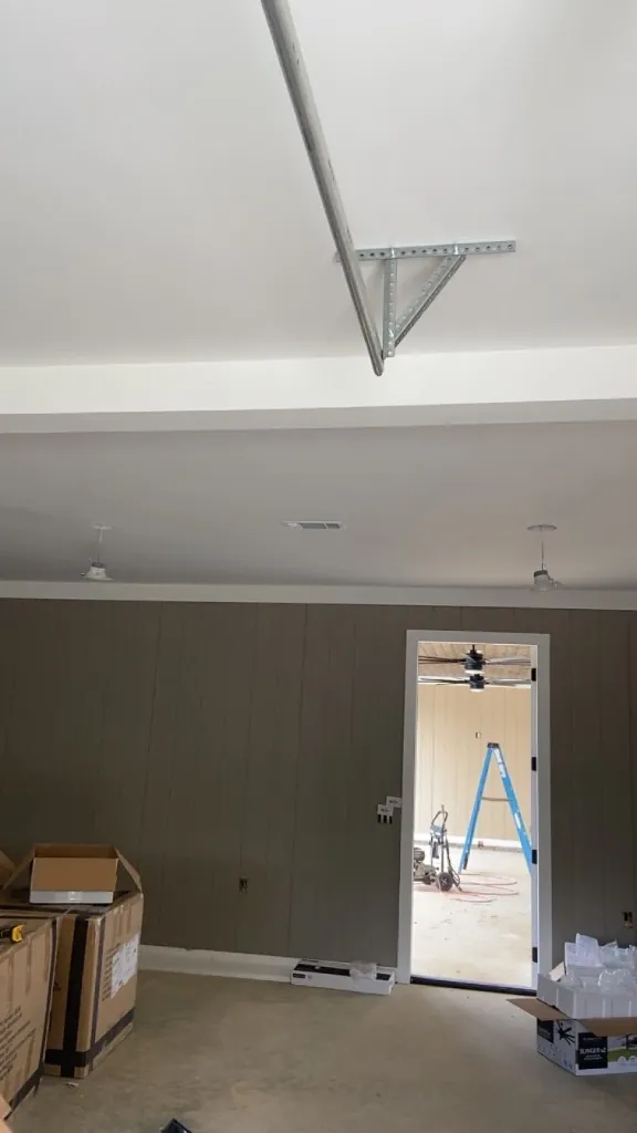 Finished painted bonus room interior with trim work